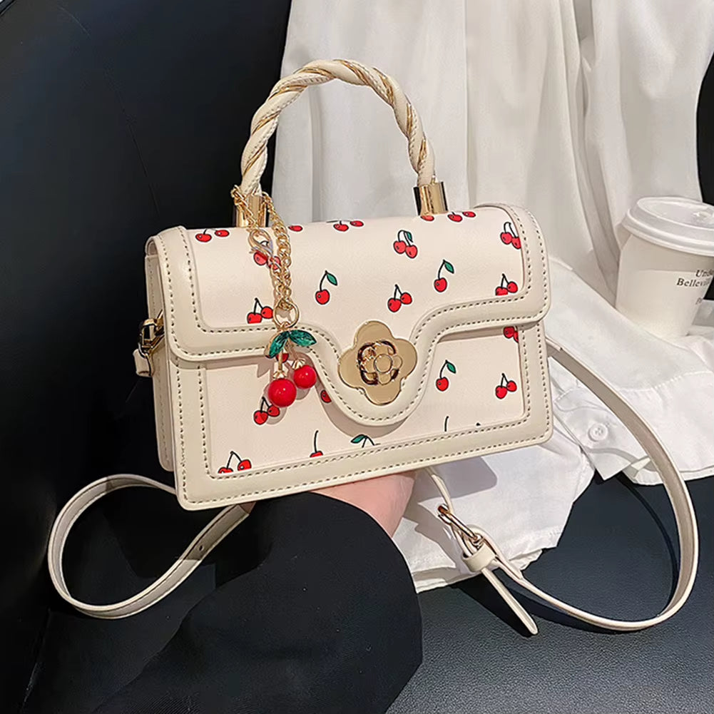cherry blossom handbag | twist handle shoulder bag | floral handbag for women | elegant women’s purse | cherry blossom purse | stylish shoulder bag | floral fashion bag | women’s casual handbag | trendy floral purse | blossom print bag | spring fashion handbag | cute twist handle bag | feminine shoulder bag