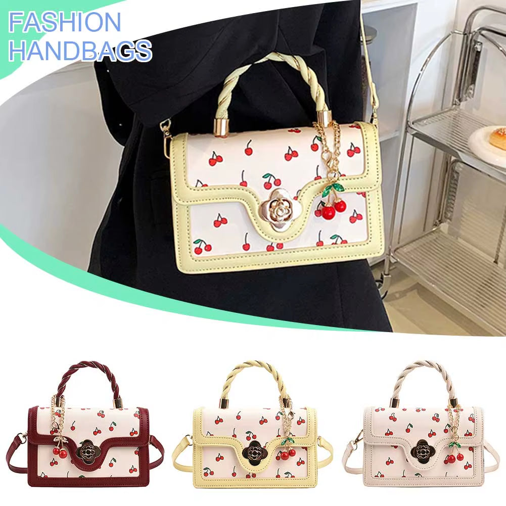 cherry blossom handbag | twist handle shoulder bag | floral handbag for women | elegant women’s purse | cherry blossom purse | stylish shoulder bag | floral fashion bag | women’s casual handbag | trendy floral purse | blossom print bag | spring fashion handbag | cute twist handle bag | feminine shoulder bag