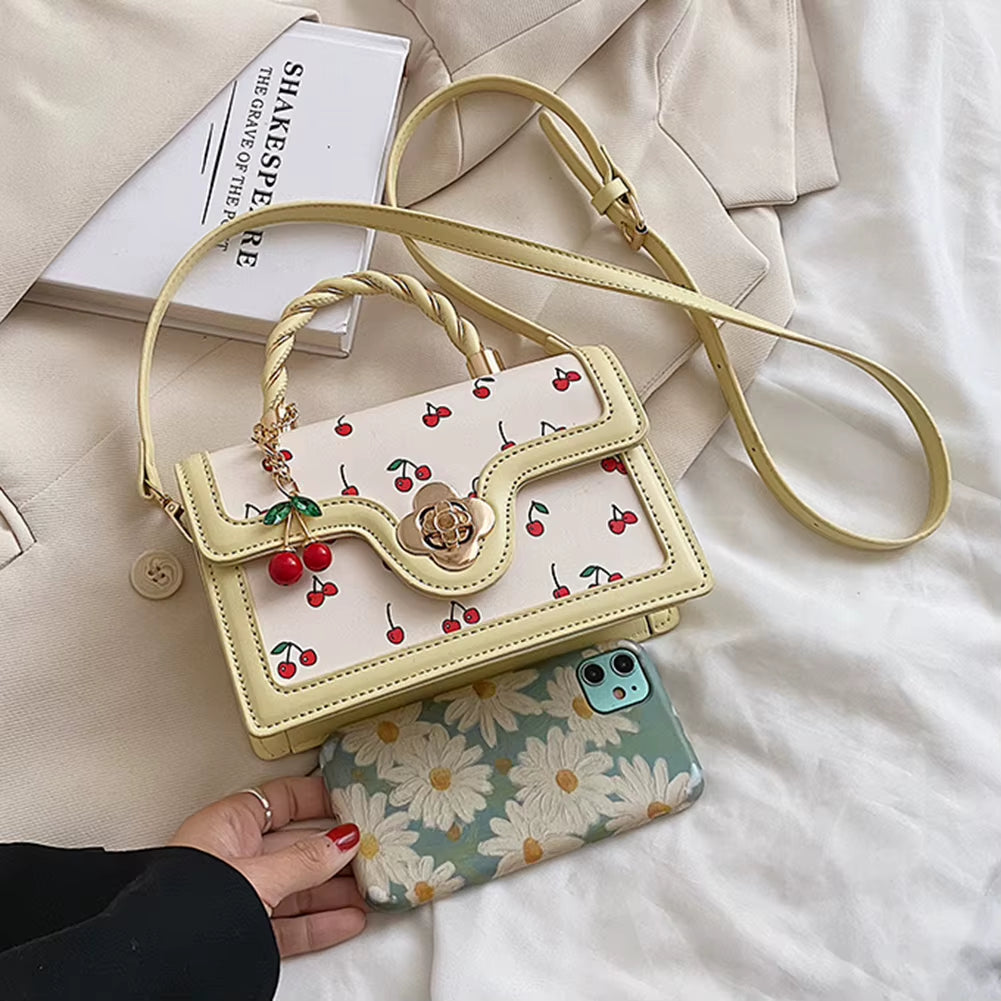 cherry blossom handbag | twist handle shoulder bag | floral handbag for women | elegant women’s purse | cherry blossom purse | stylish shoulder bag | floral fashion bag | women’s casual handbag | trendy floral purse | blossom print bag | spring fashion handbag | cute twist handle bag | feminine shoulder bag