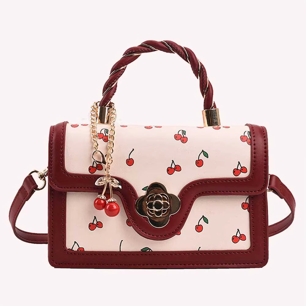 cherry blossom handbag | twist handle shoulder bag | floral handbag for women | elegant women’s purse | cherry blossom purse | stylish shoulder bag | floral fashion bag | women’s casual handbag | trendy floral purse | blossom print bag | spring fashion handbag | cute twist handle bag | feminine shoulder bag
